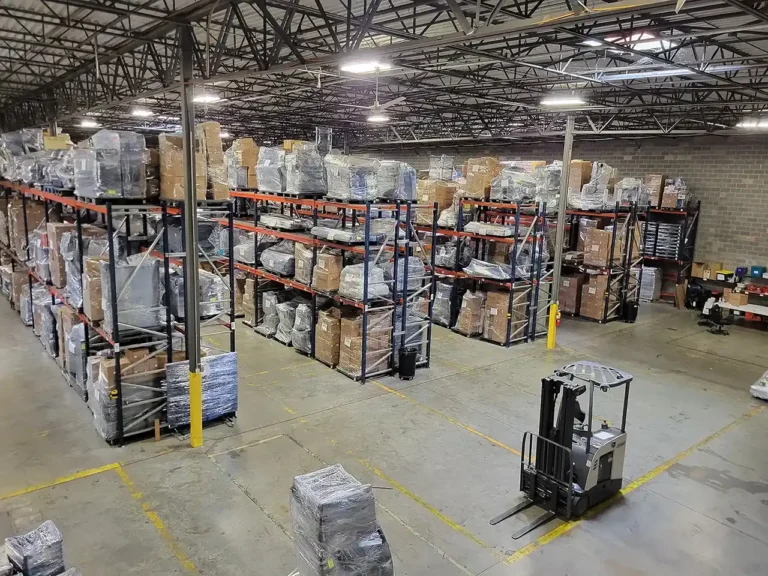 A warehouse with boxes and forklifts for contents restoration services