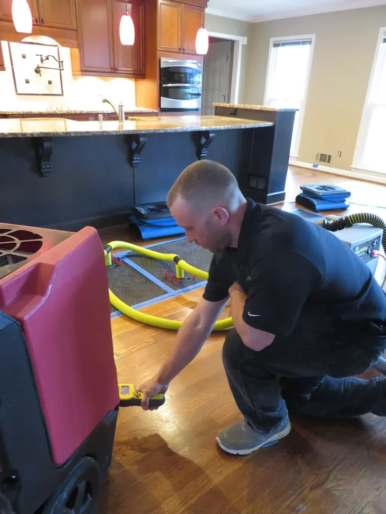 a man with water mitigation equipment